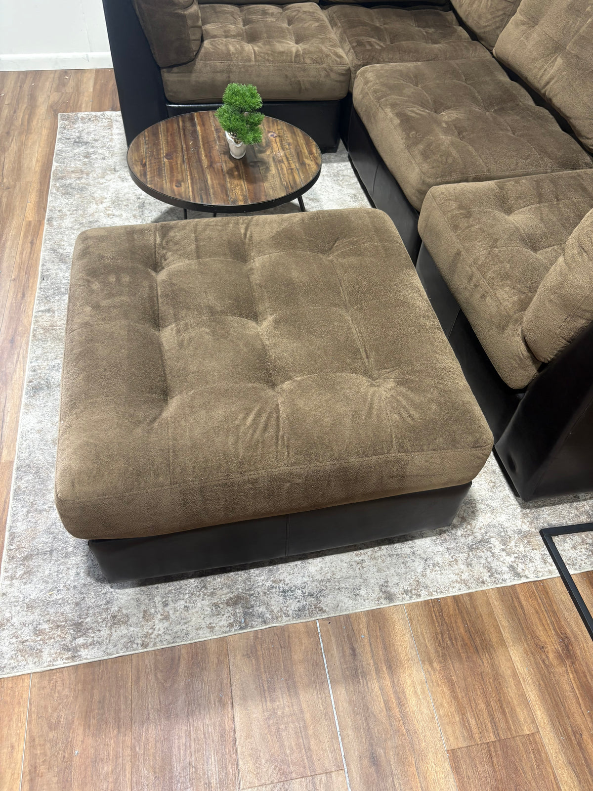 Brown Faux Leather Sectional with Fabric Cushions and Ottoman